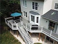 <b>Trex Transcend Island Mist Composite Deck Boards with White Washington Vinyl Railing with round aluminum balusters and a matching drink rail 2</b>